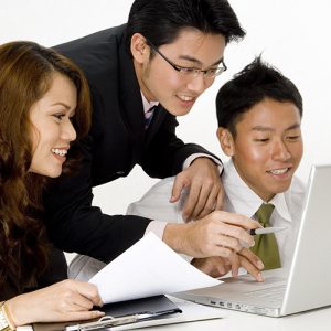 A smiling business group of young asian executives