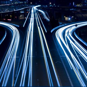 A shot of rush hour traffic on a bridge in blue tone